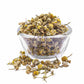 Chamomile flowers in a bowl