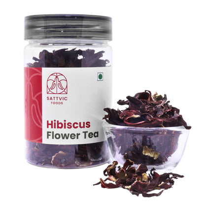 Sattvic Foods jar of loose dried hibiscus flower with a bowl beside it.