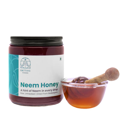 Neem Honey in a jar with a glass bowl of neem honey besides it.