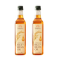Two bottles of Samkhya Rice Bran Oil on a white background