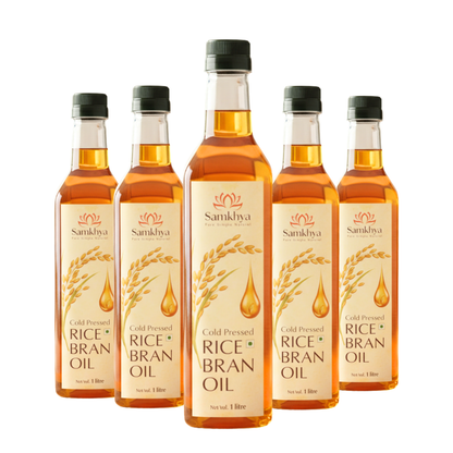 Five bottles of Sankhya Rice Bran Oil on a white background