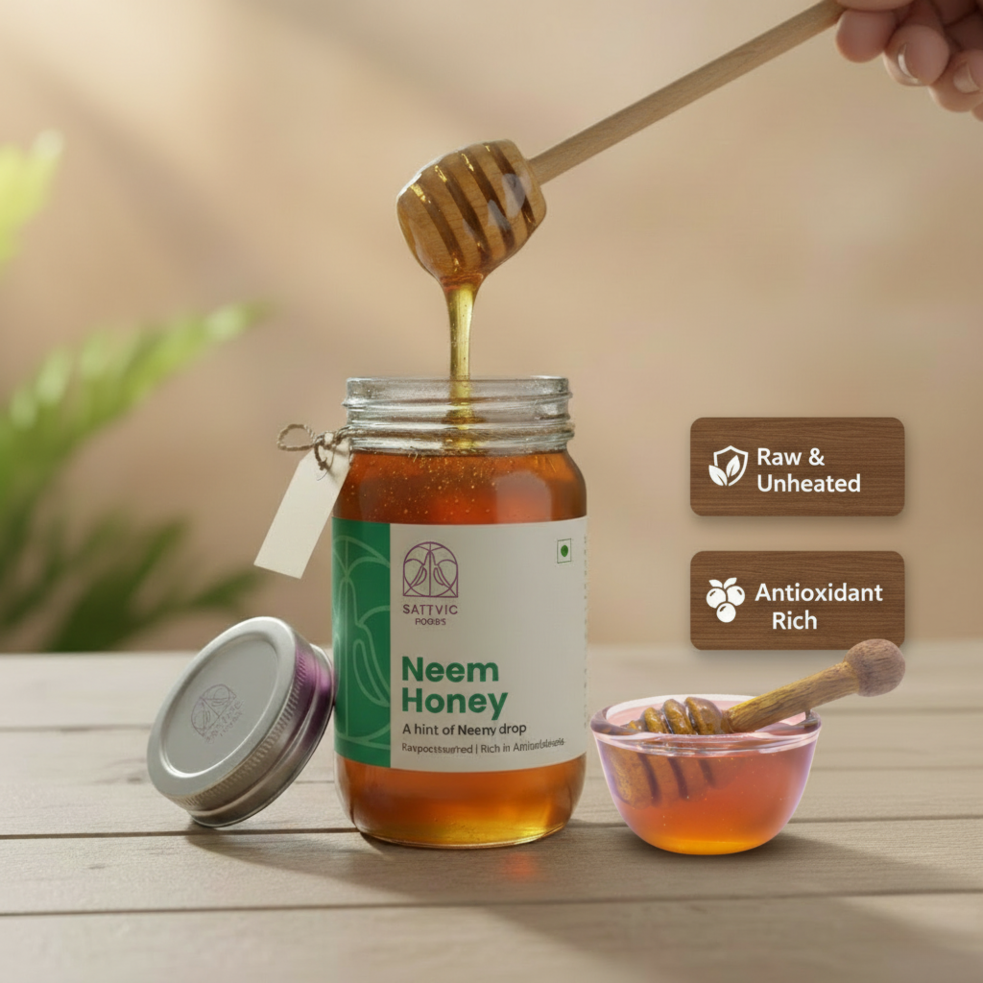 Jar of neem honey with a honey dipper, on a wooden surface.