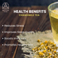 A cup of chamomile tea on a wooden table with chamomile flowers, highlighting its health benefits.