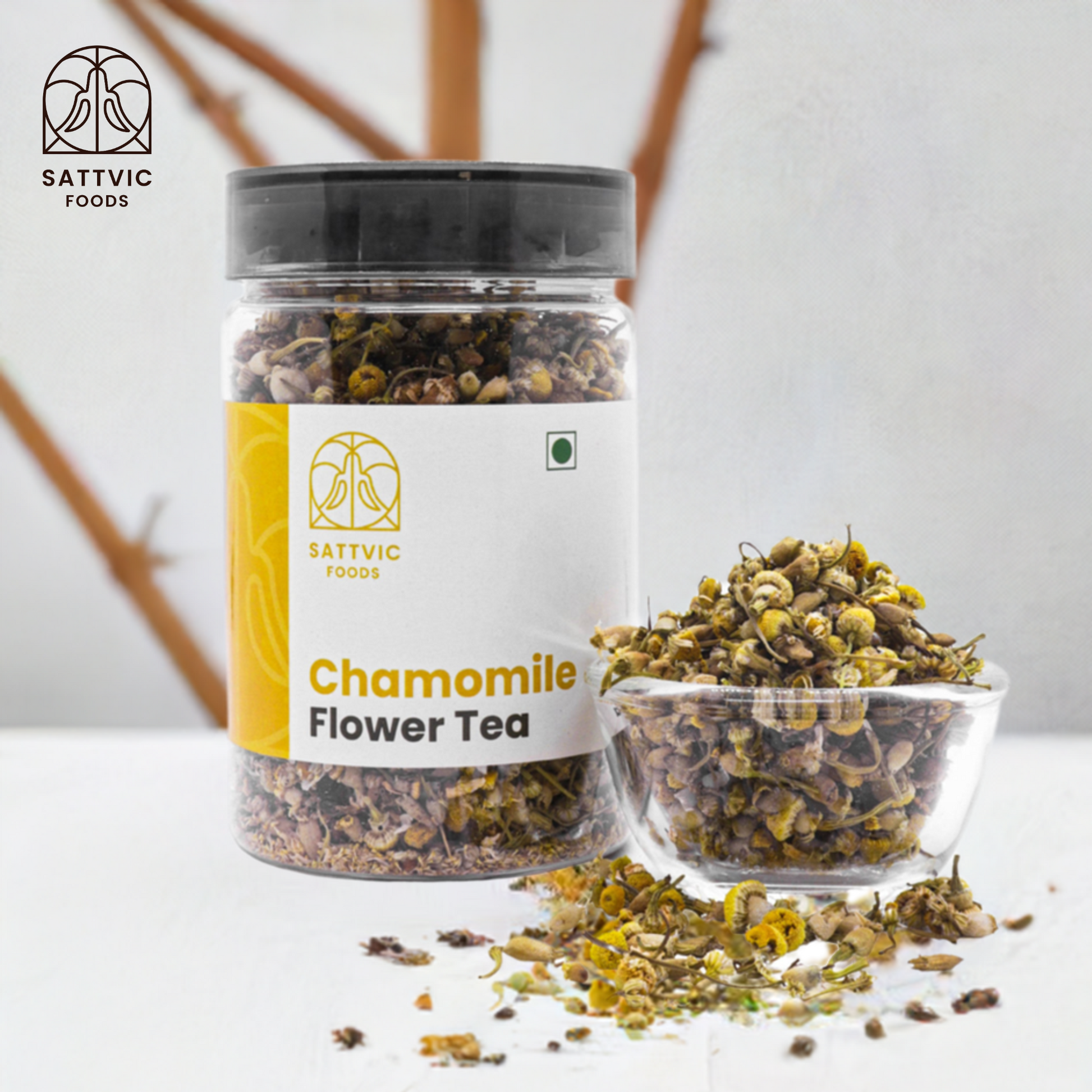 Sattvic Foods Chamomile Flower Tea jar with dried chamomile flowers beside it in a glass bowl