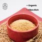 A bowl of khapli rava with wheat grains around it