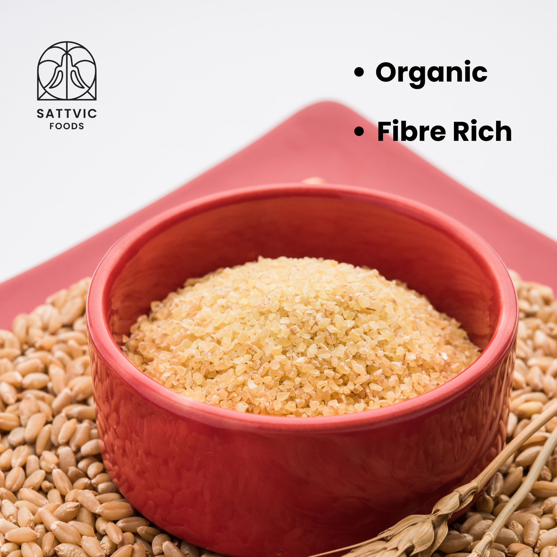 A bowl of khapli rava with wheat grains around it