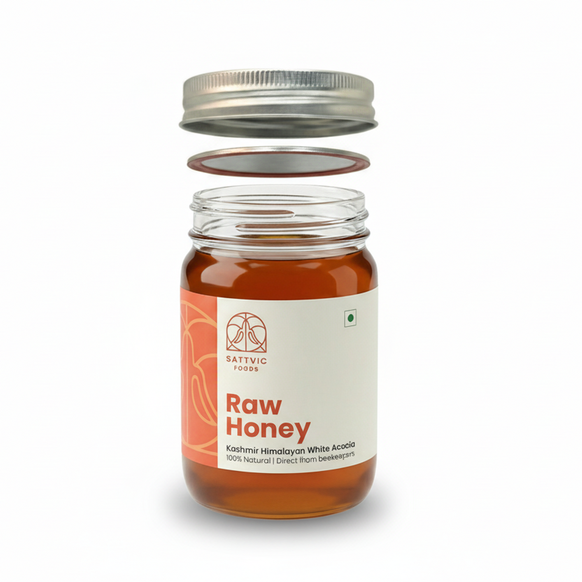 Jar of raw honey with a white label on a white background